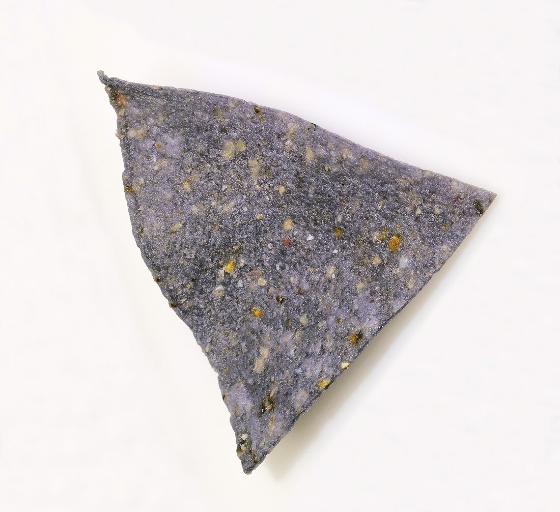 A Single Blue Corn Chip on a White Background