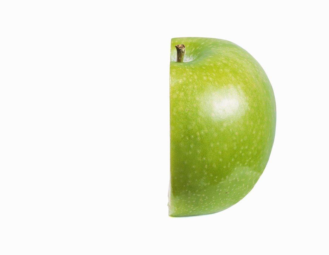 Half of a Granny Smith Apple on a White Background