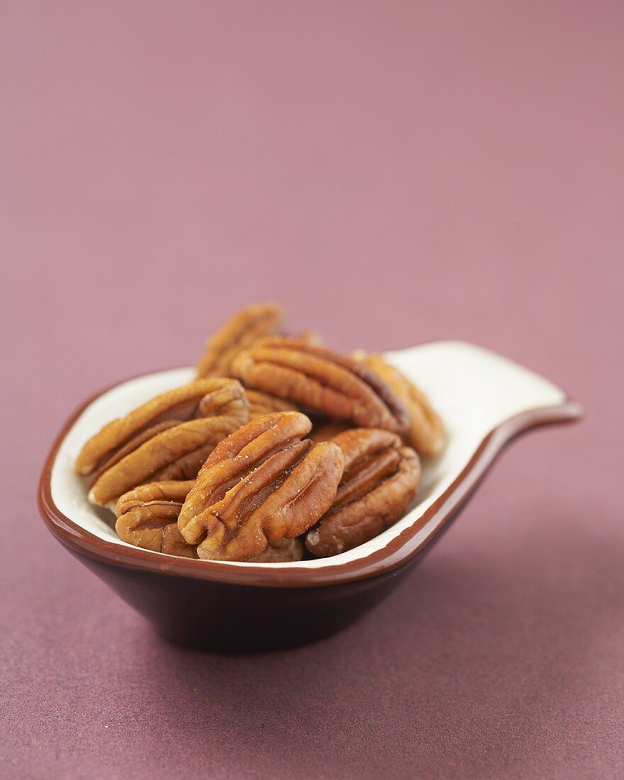 Whole Pecans in a Small Measuring Spoon