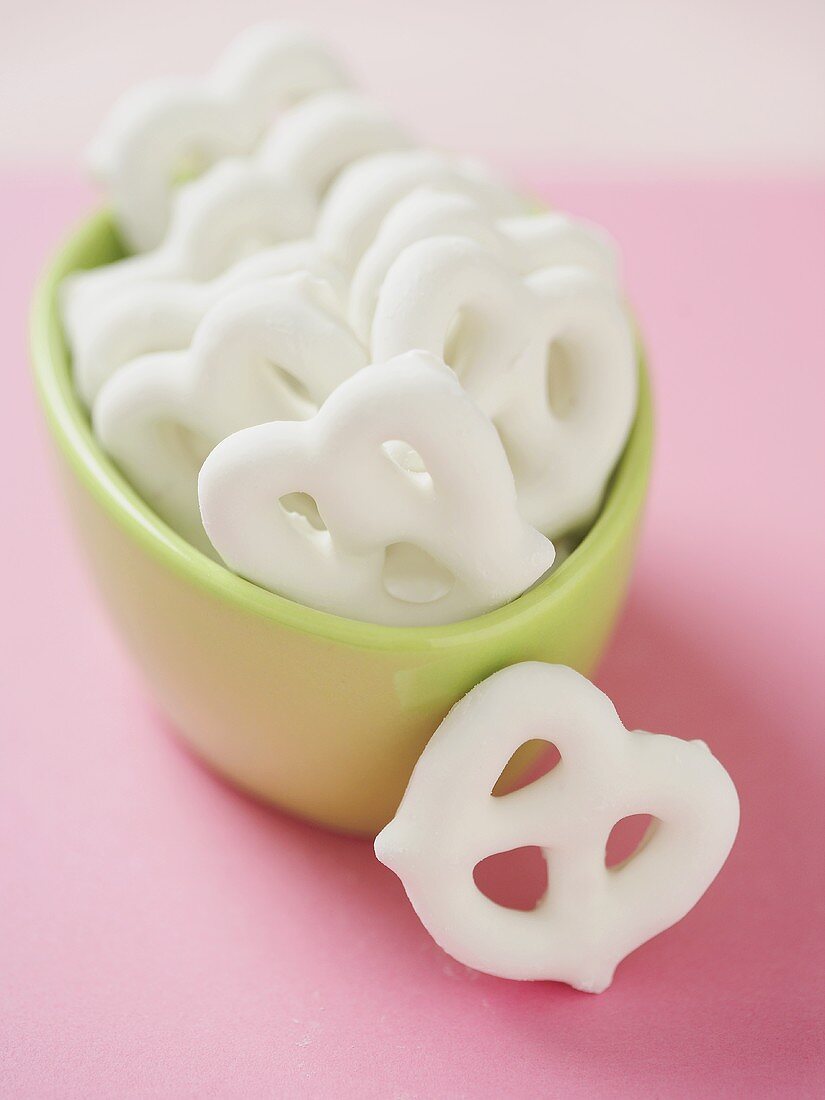 Yogurt Covered Pretzels in a Bowl, One Next to Bowl