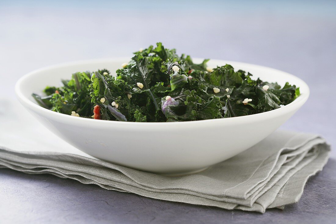 Kale with Bacon in a White Bowl