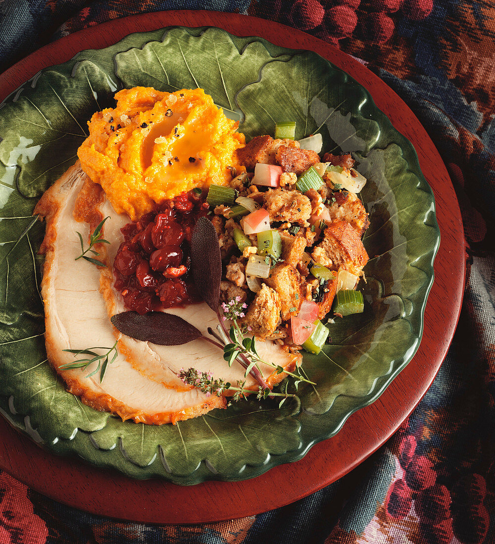 Sliced Turkey with Stuffing Cranberries and Mashed Potatoes