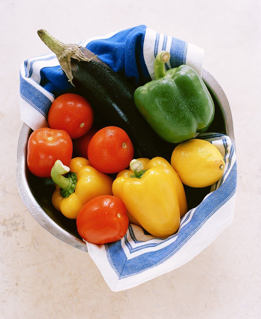 A Bowl of Fresh Vegetables: Peppers, Eggplant and Tomatoes