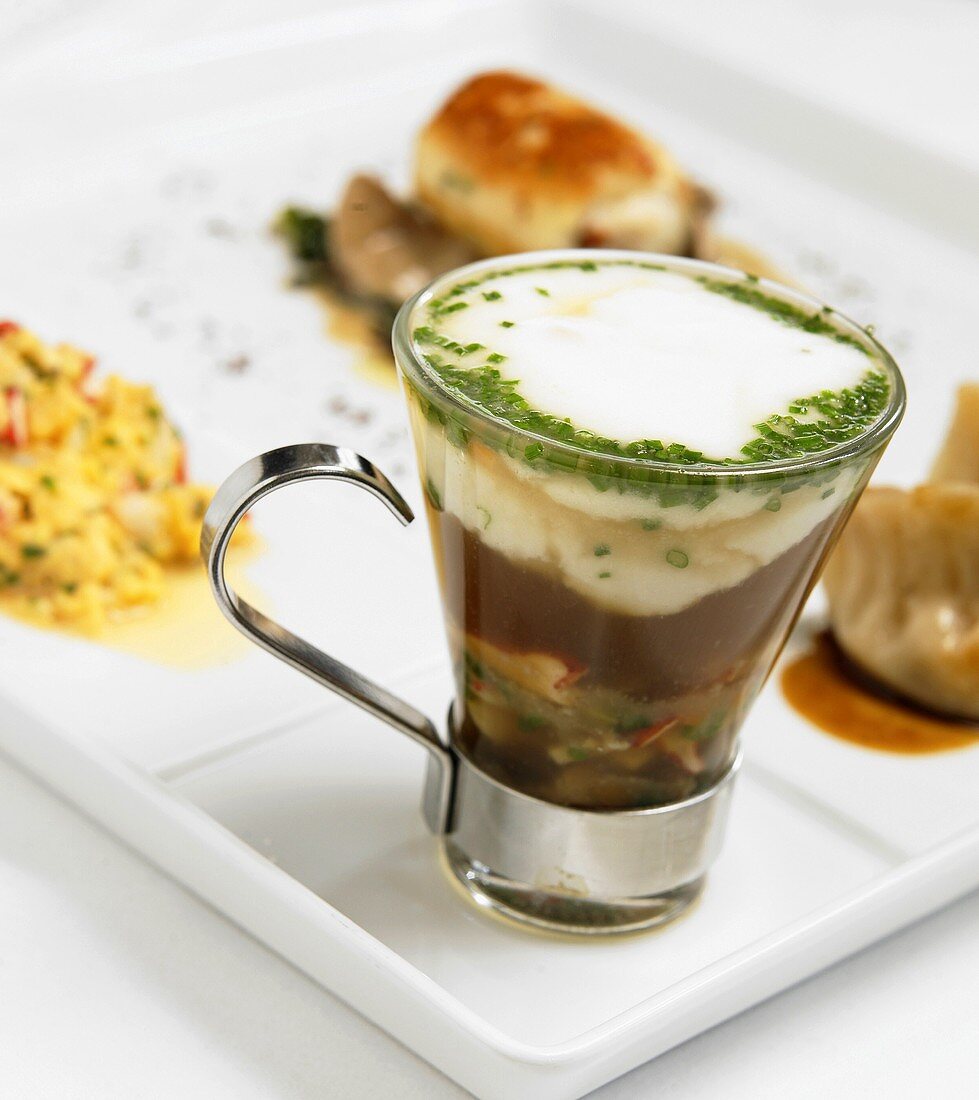 Lobster Chowder in an Glass Espresso Mug with other Assorted Small Lobster Dishes