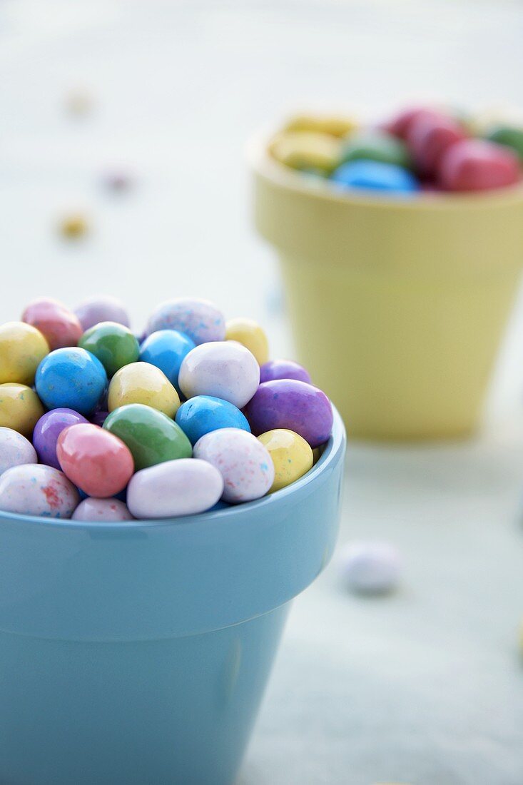 Candy Coated Chocolate Eggs in Colorful Flower Pots
