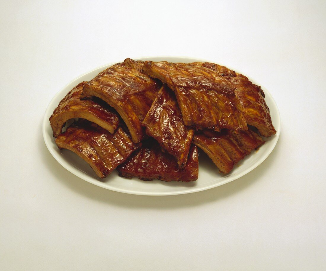 Platter of Barbecue Pork Ribs on a White Background