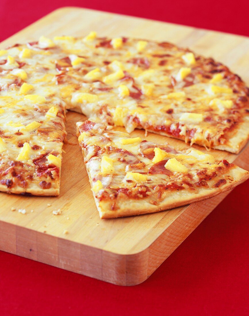 Hawaiian Pizza, One Slice Pulled Out License Images 672369 StockFood