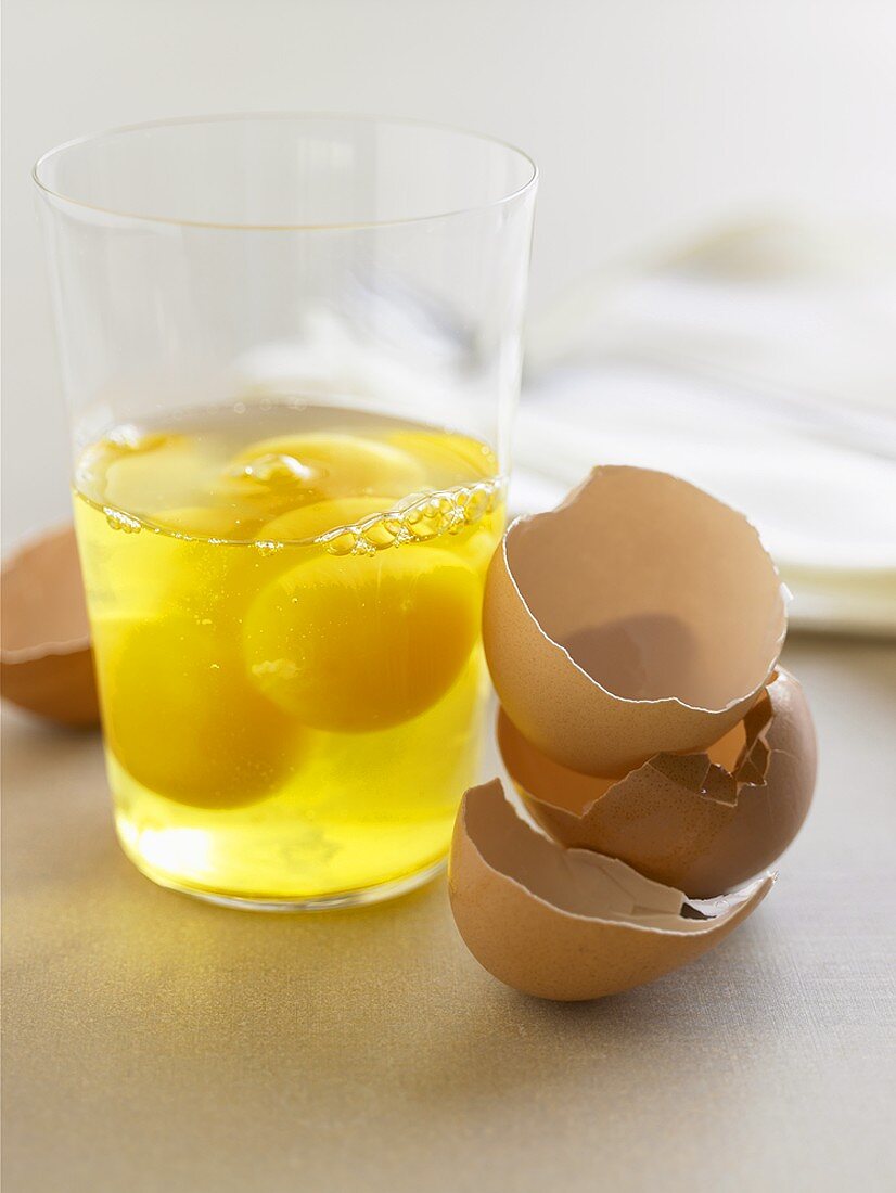 Cracked Eggs in a Glass with Egg Shells