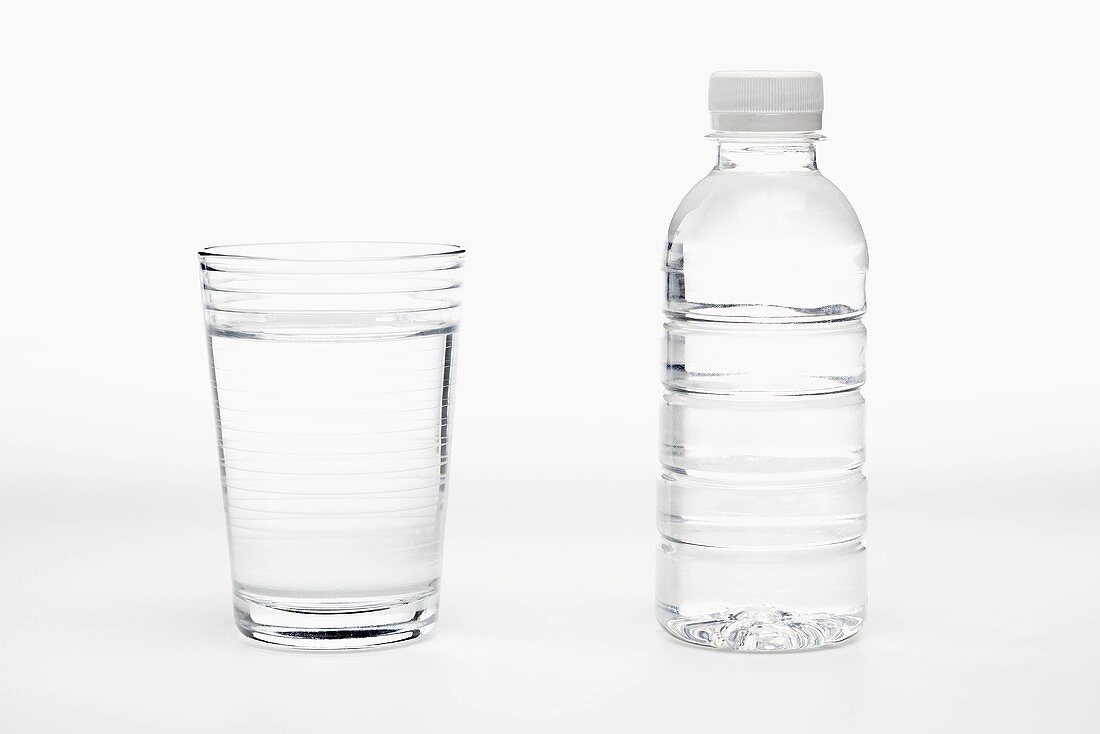 Glass of Water with a Bottle of Water, White Background