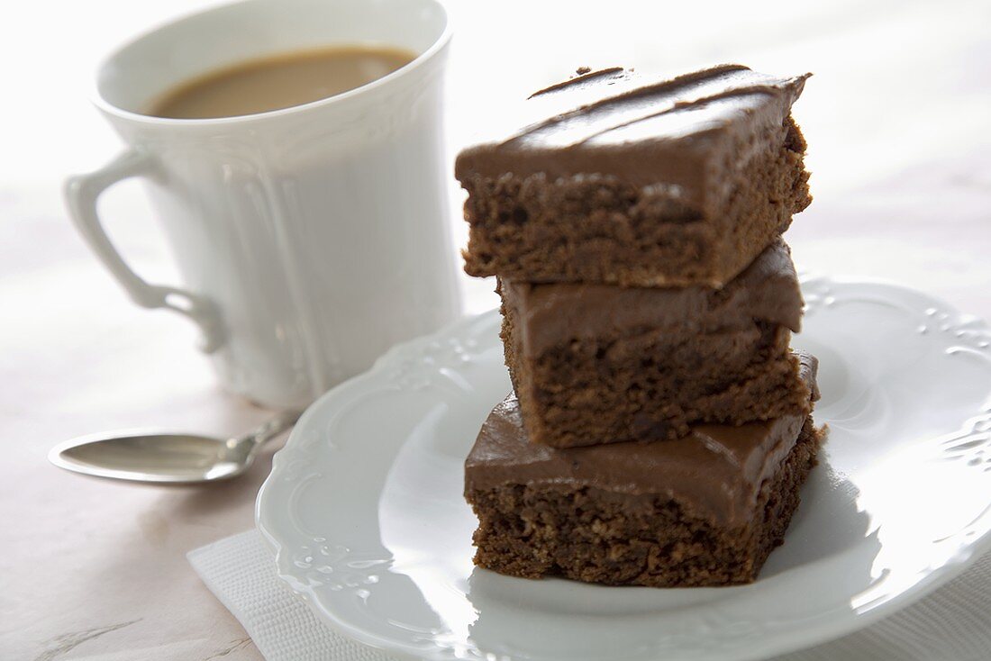 Stack of Brownies with a Cup of Coffee