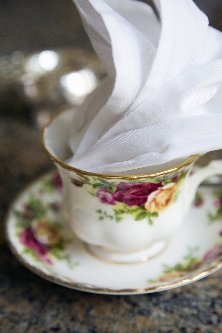 A Single Porcelain Tea Cup with Linen Napkin Set for High Tea