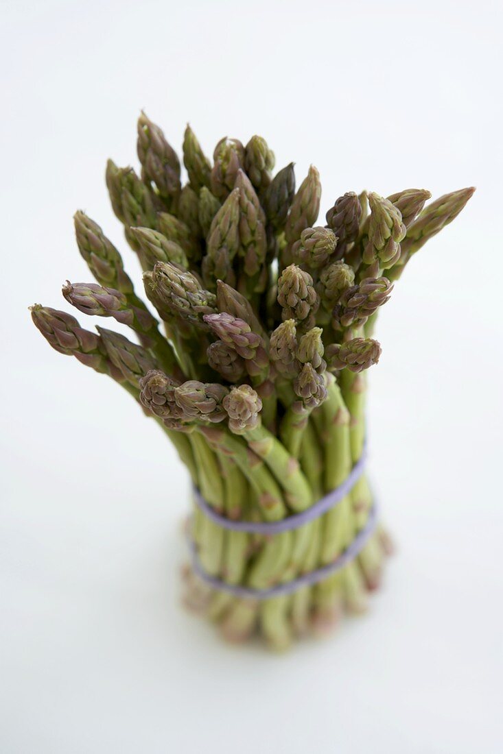 Bundle of Organic Asparagus on a White Background