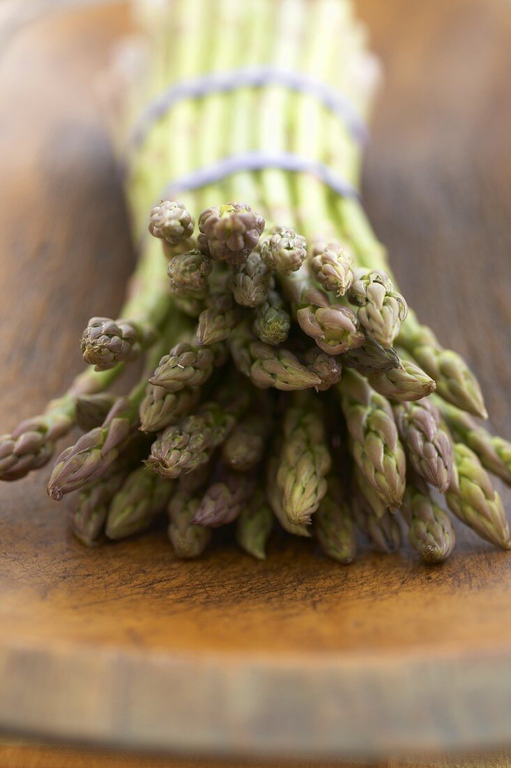 Close Up of the Tips of a Bundle of Organic Asparagus