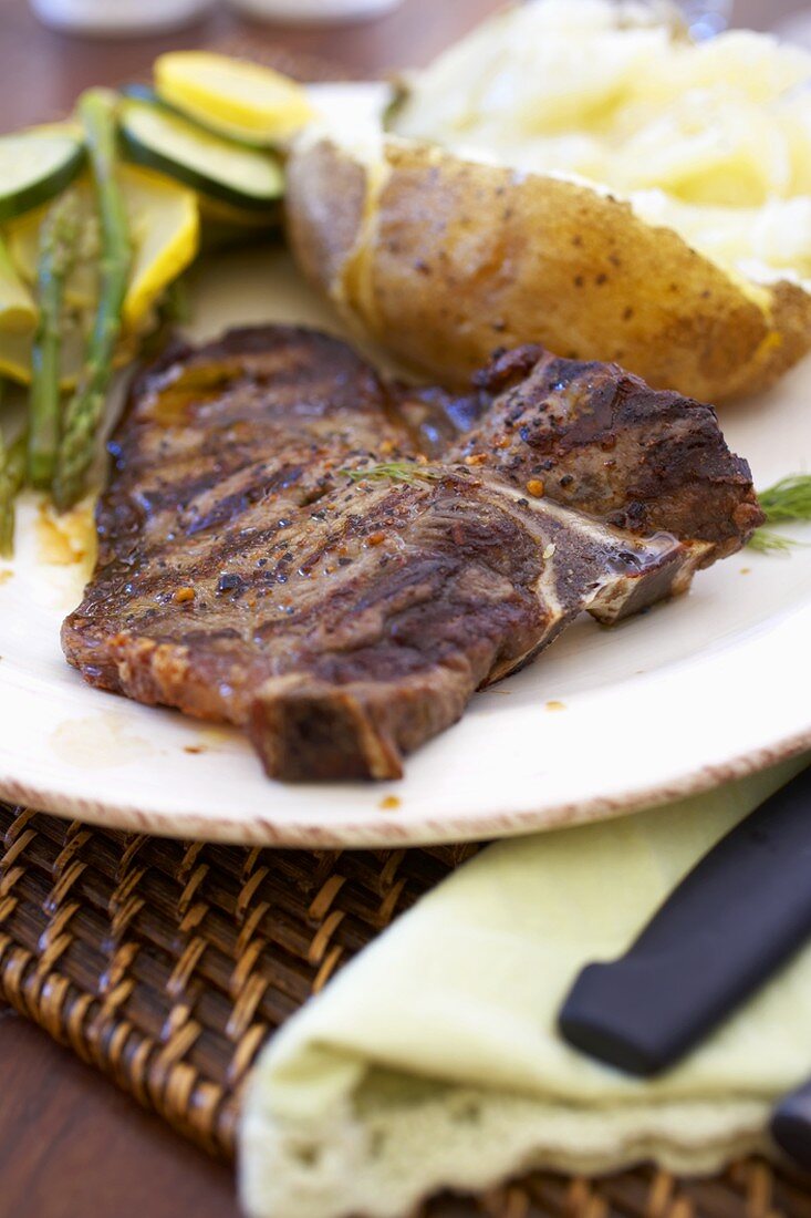 Grilled T-Bone Steak with Baked Potato and Vegetables