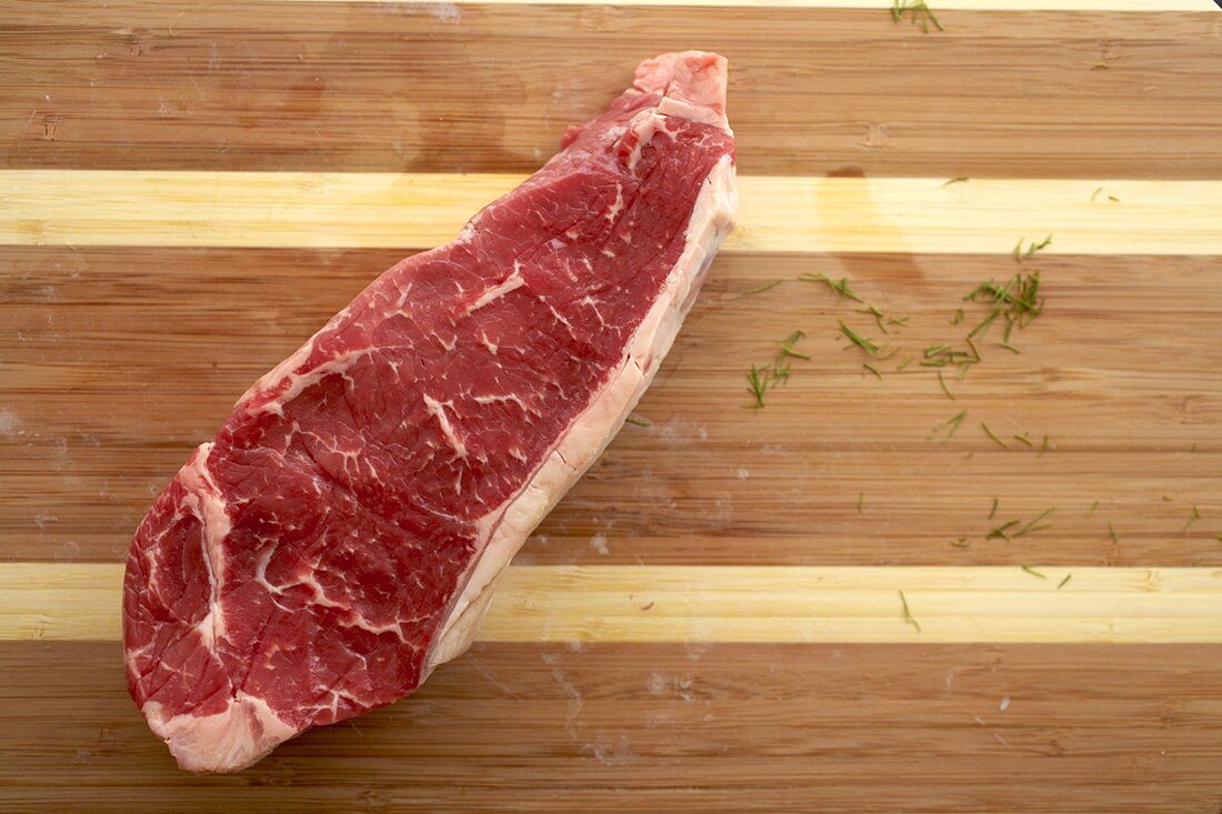 Raw Top Sirloin Steak on a Cutting Board
