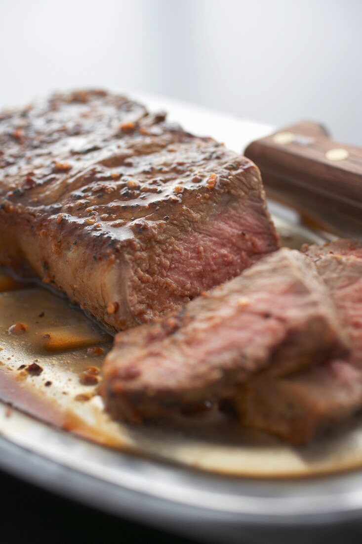 Close Up of Partially Sliced Top Sirloin Steak