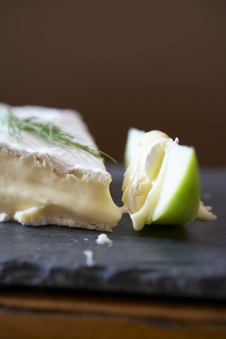 A Wedge of Brie with a Granny Smith Apple Slice