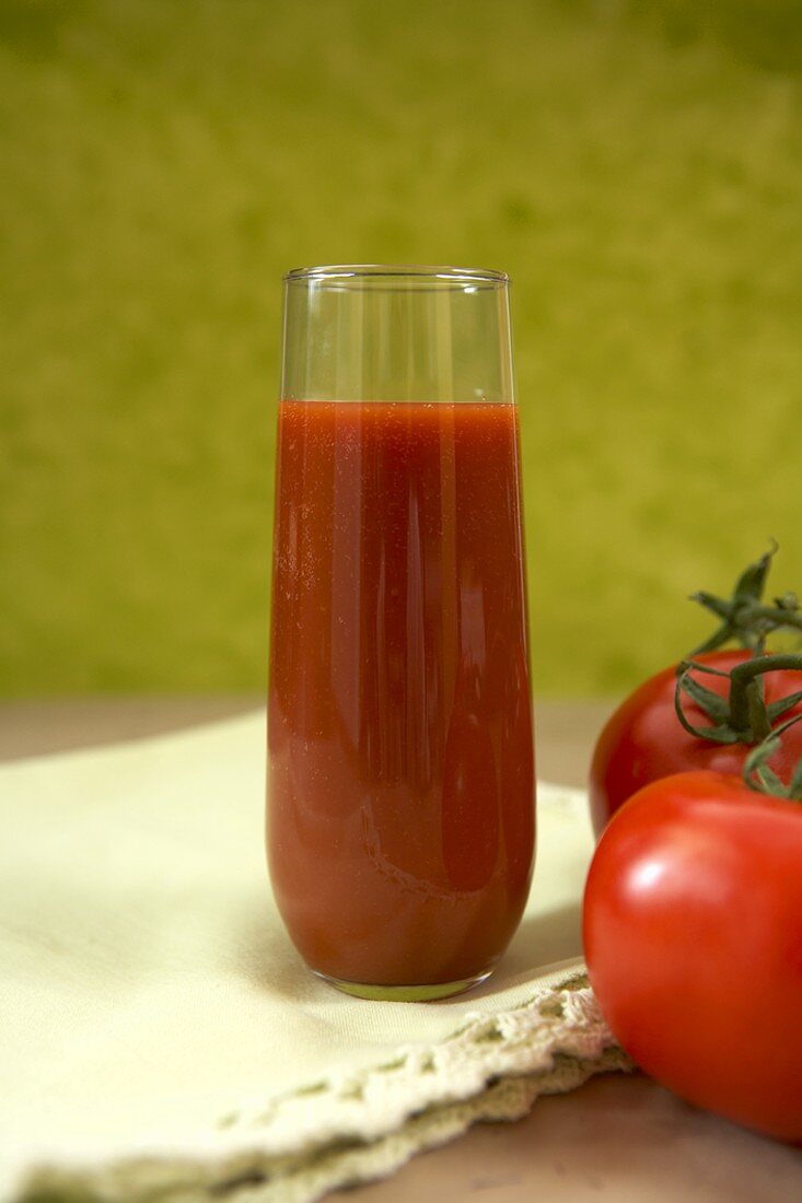 Glass of Tomato Juice with Vine Ripe Tomatoes