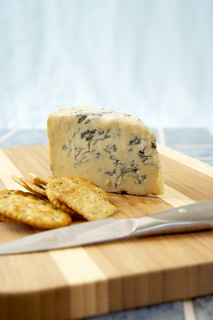 Gorgonzola Piccanta Cheese with Crackers on a Cheese Board