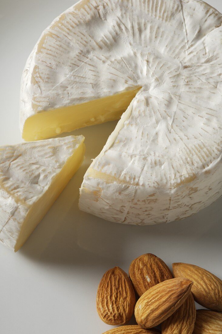 Wheel of Camembert With Wedge Removed, Almonds