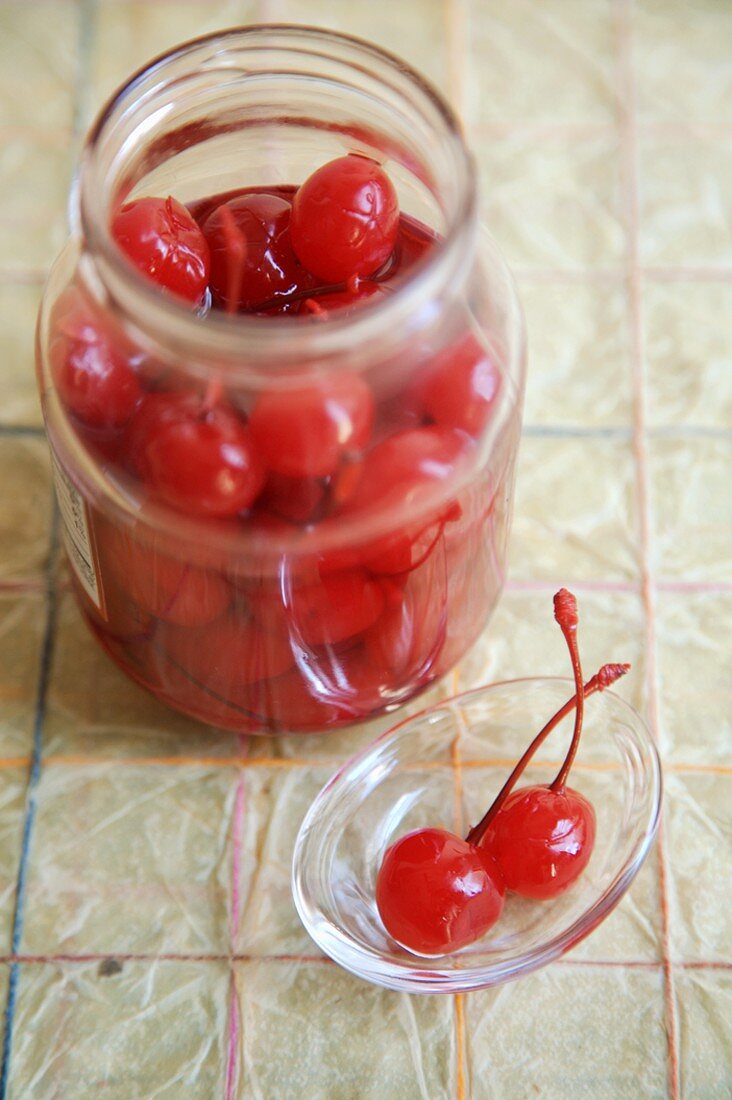 Jar of Maraschino Cherries, Two on a Small Dish