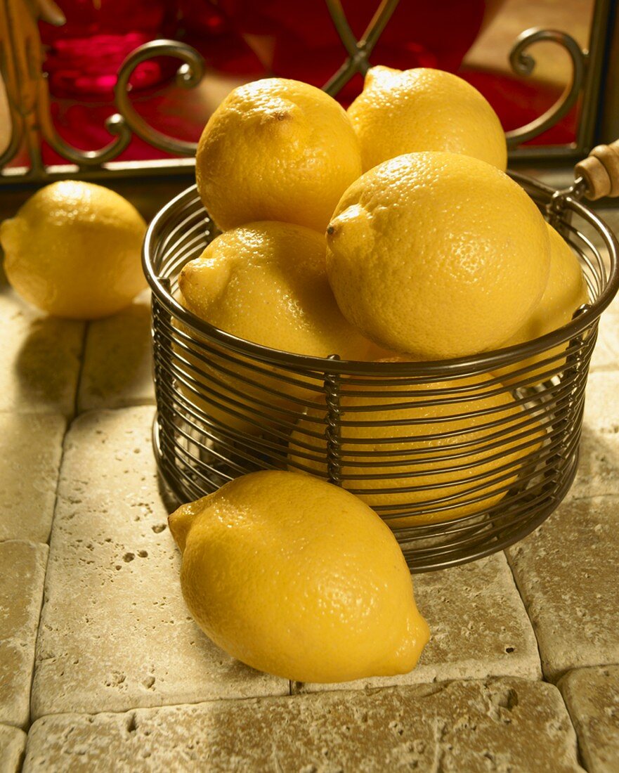 Wire Basket of Lemons on Italian Tiles