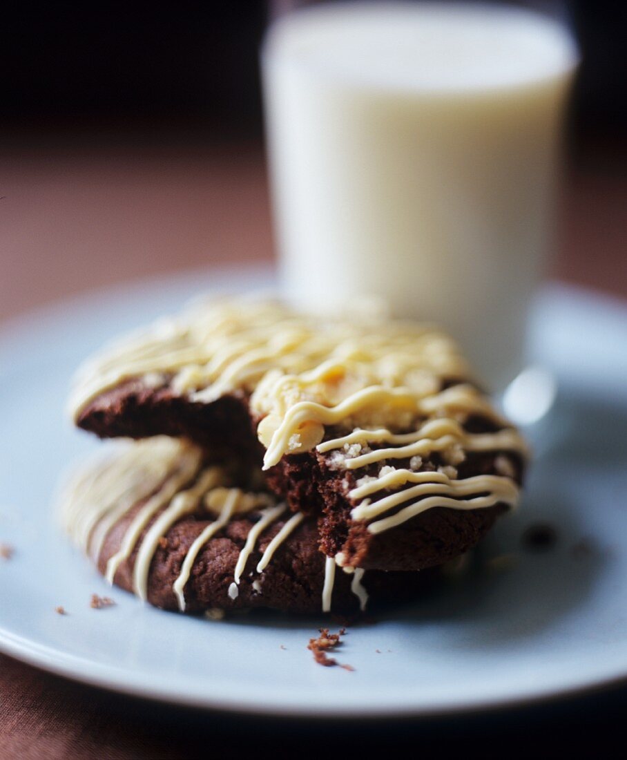 Chocolate biscuits, glass of milk in background