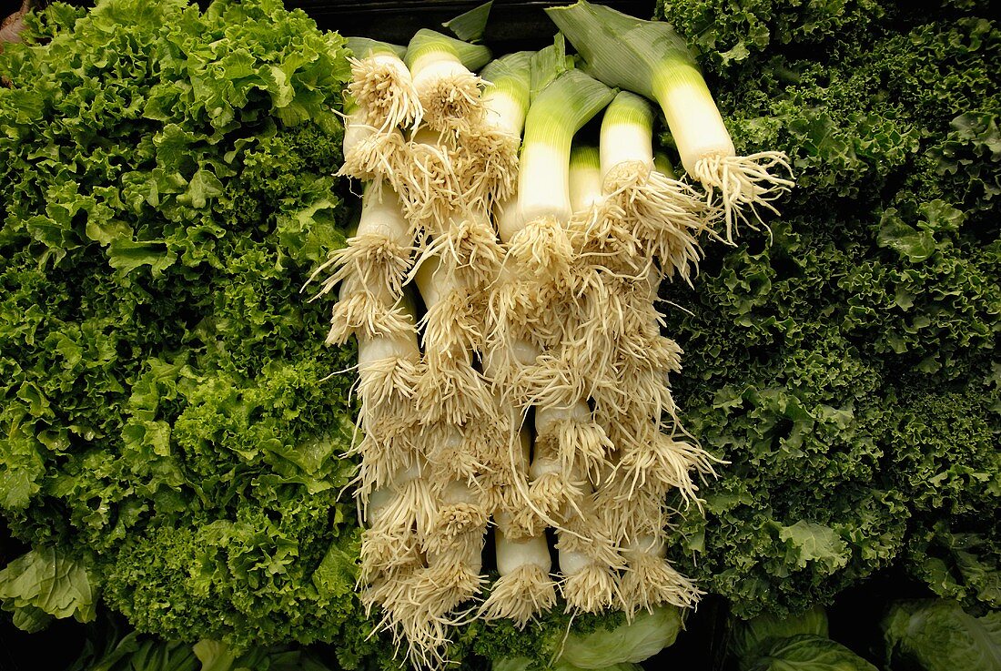 Leeks (root end) and greens at a market