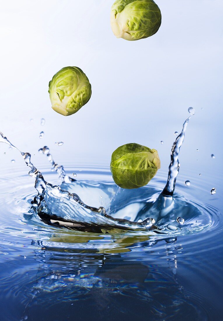 Brussels sprouts falling into water