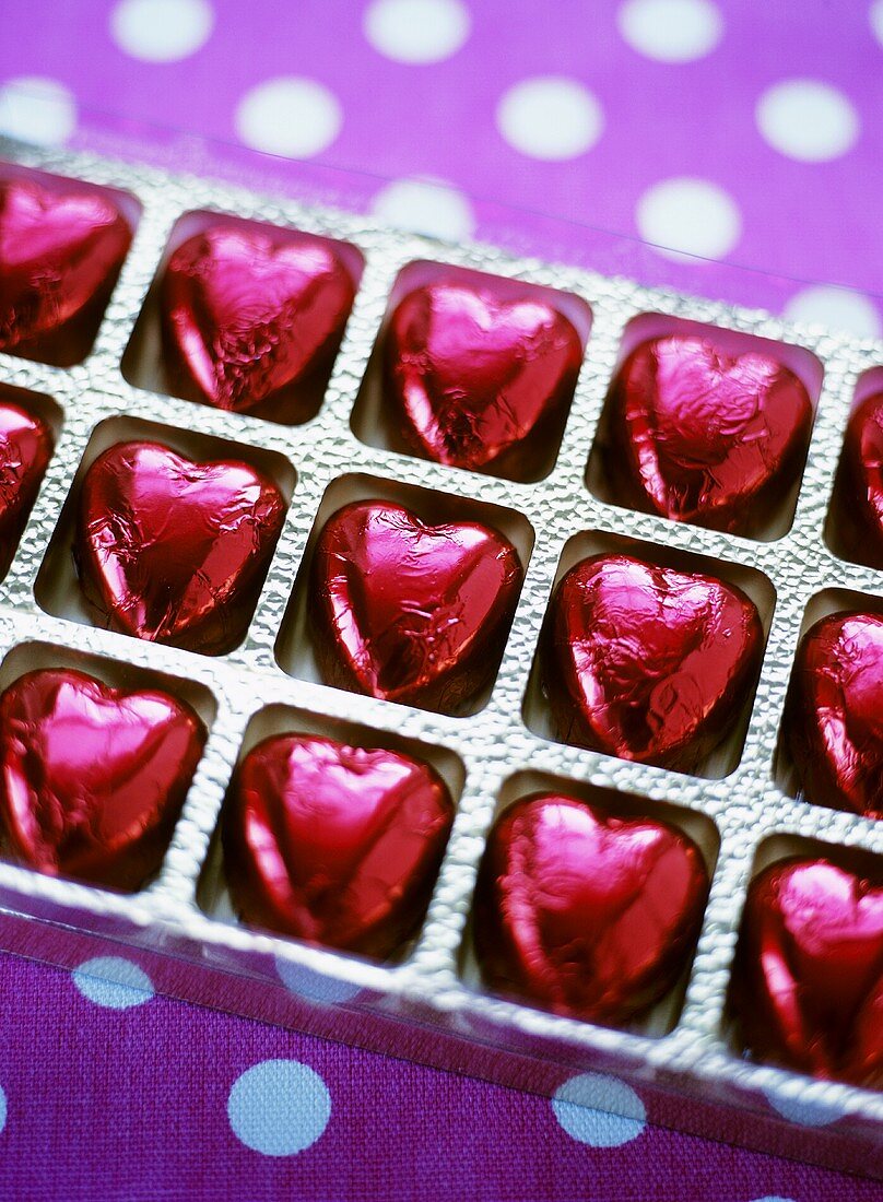 Heart-shaped chocolates, in red foil