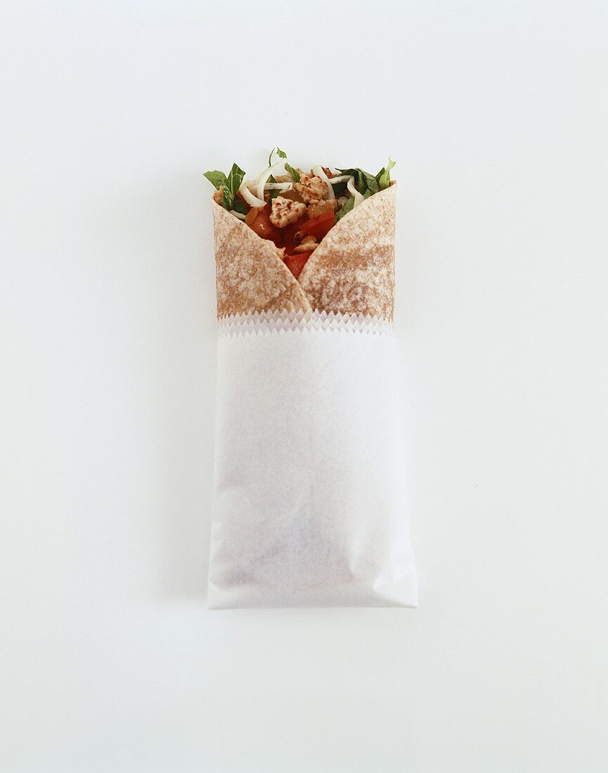 A wrap with chicken and vegetable filling