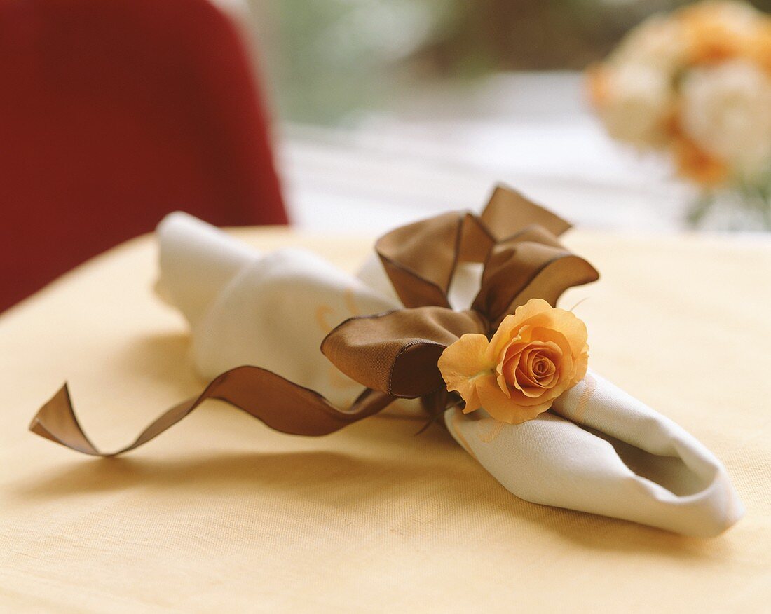Napkin with rose and bow