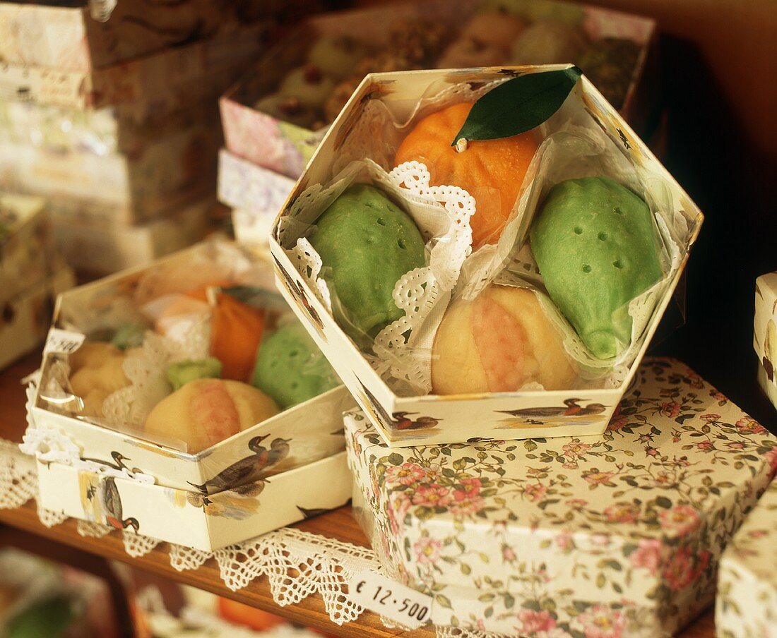 Marzipan fruits in gift boxes in shop