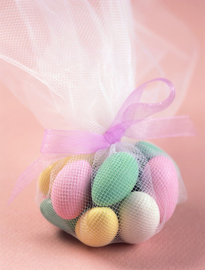 Sugared almonds in pink net