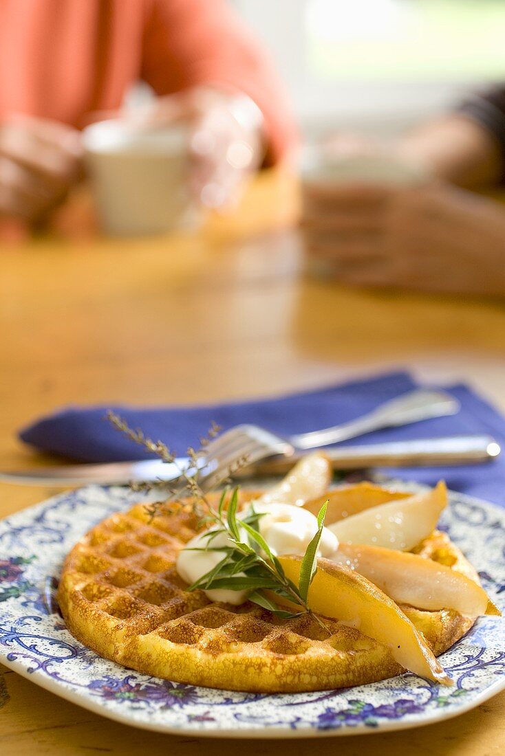 A Waffle with Poached Pear Slices and Herbs