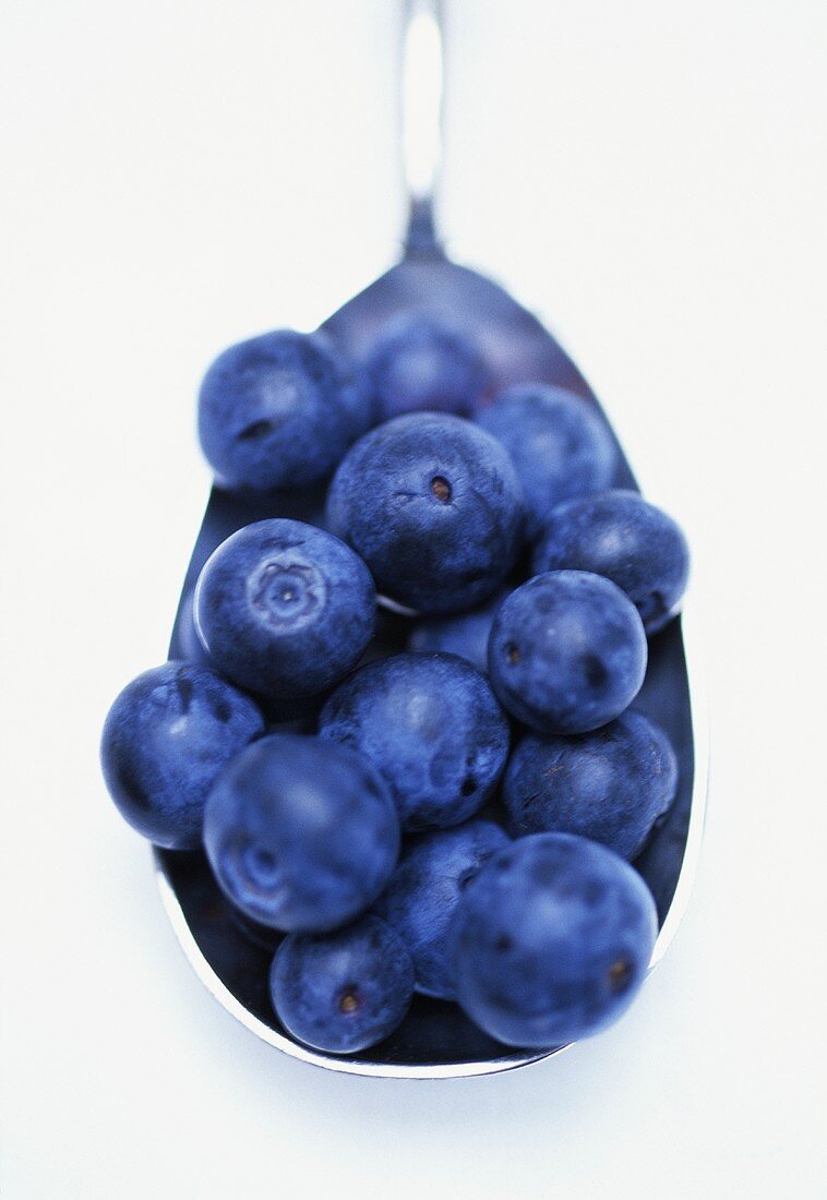 Fresh blueberries in spoon