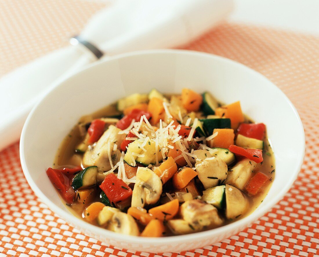 Colourful vegetable soup with mushrooms, carrots and courgettes