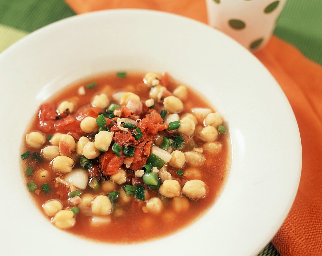 Tomato and chickpea soup with spring onions