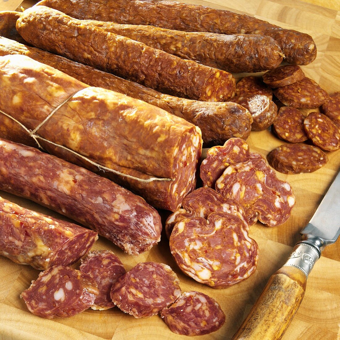Paprika sausage, sopressata and Calabrese sausages, slices cut