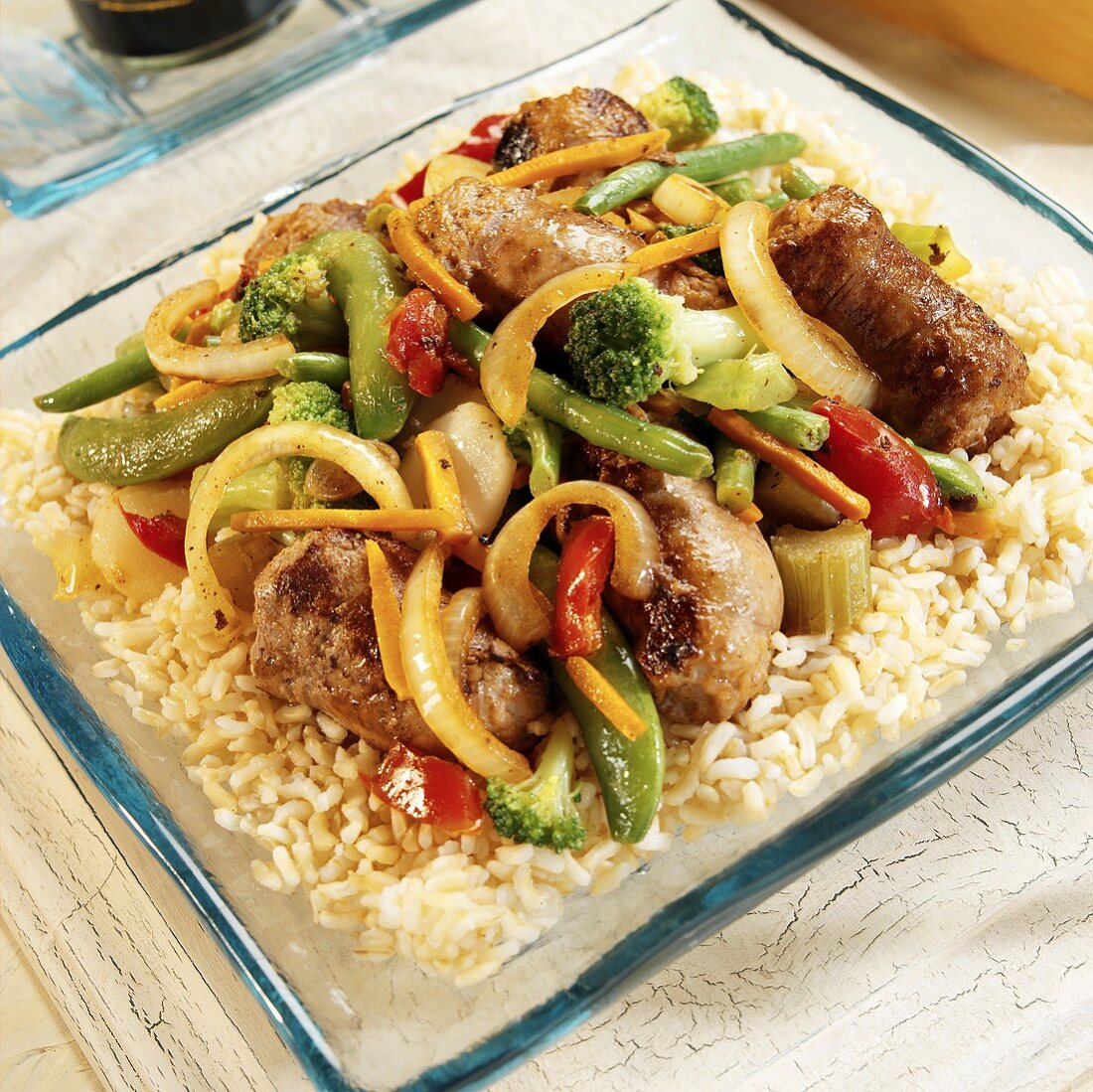 Turkey sausages with vegetables on rice