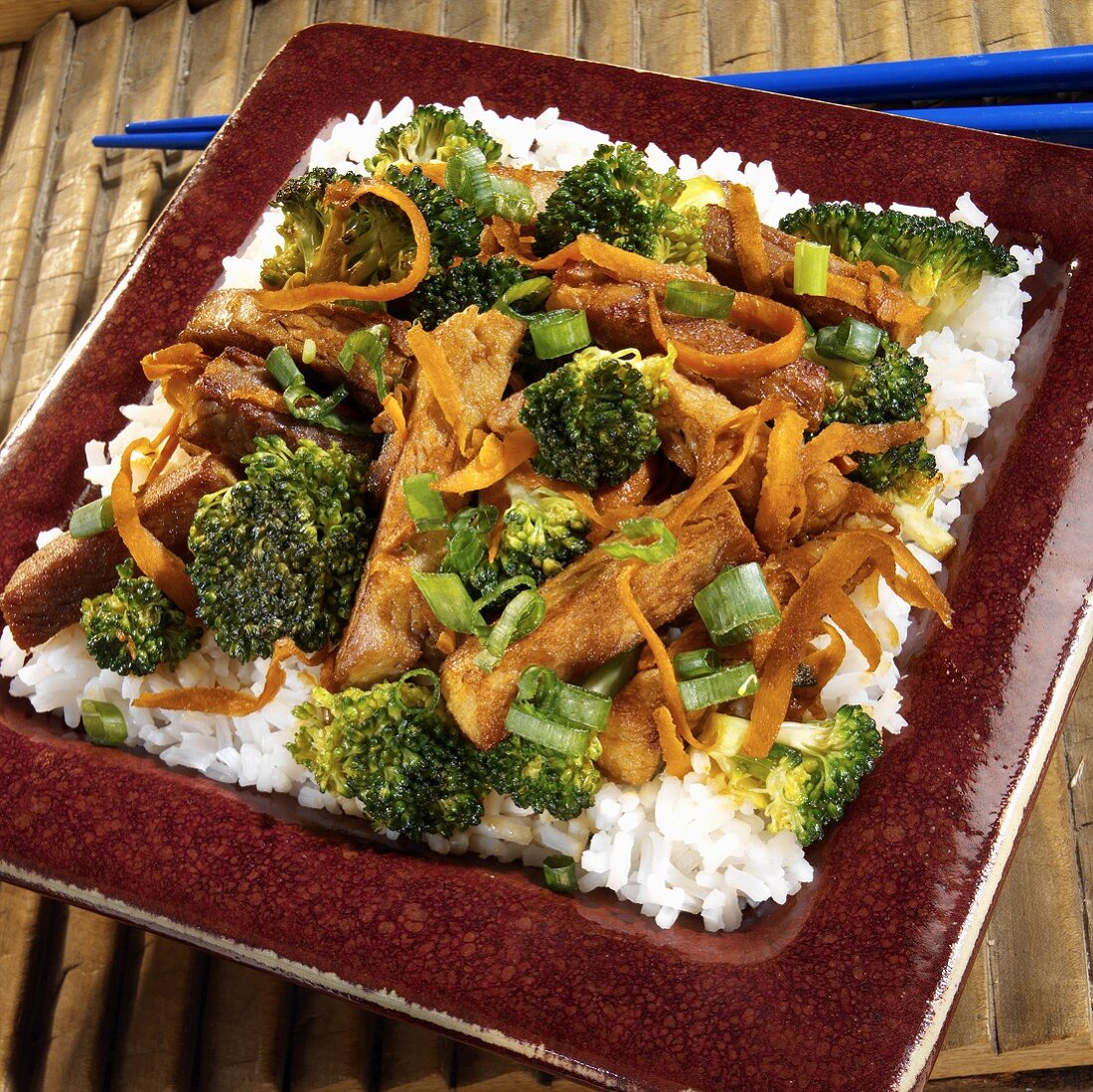 Strips of pork with broccoli on rice