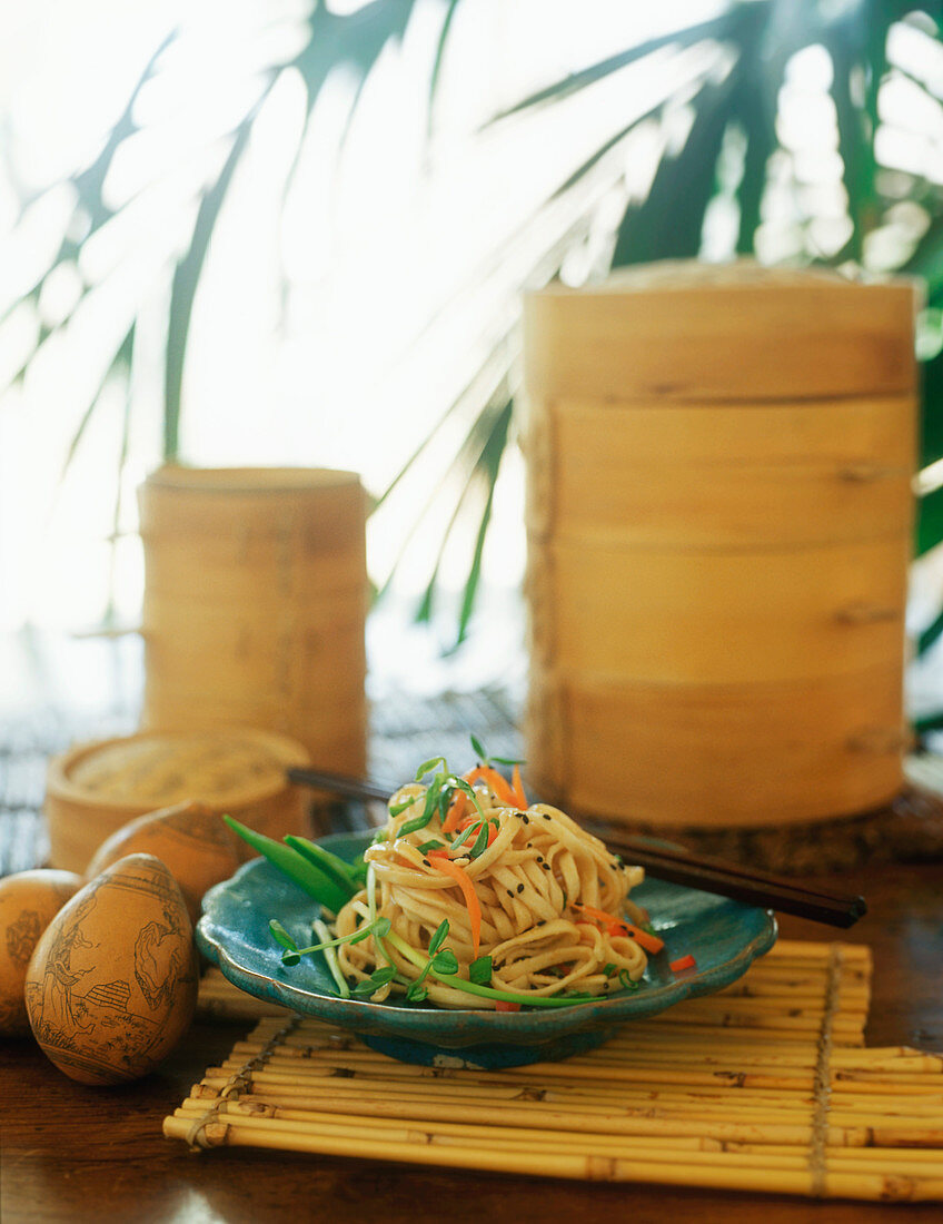 Ribbon noodles with vegetables and black sesame (Asia)