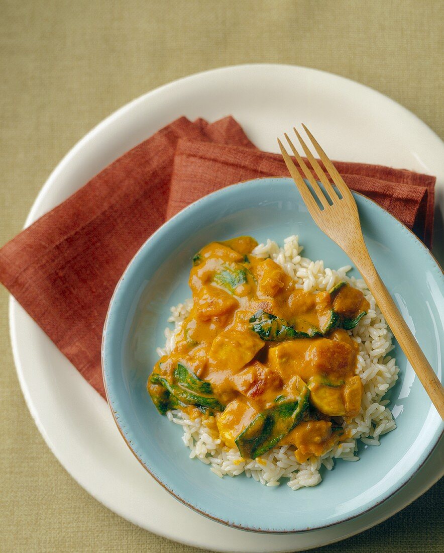 Curried Chicken Over Basmati Rice with Wooden Fork