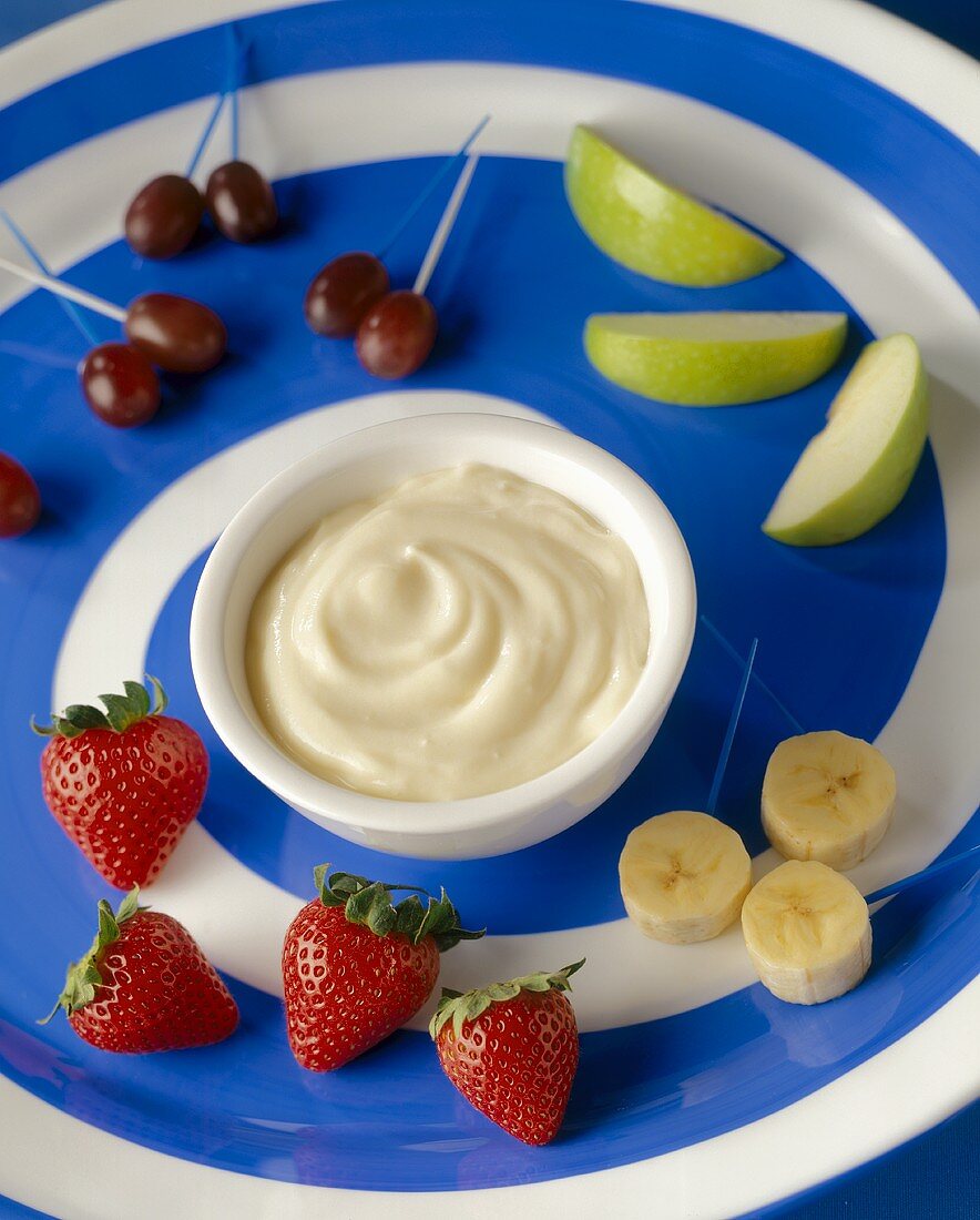 Fruit with Vanilla Yogurt Dip on a Blue and White Swirled Platter