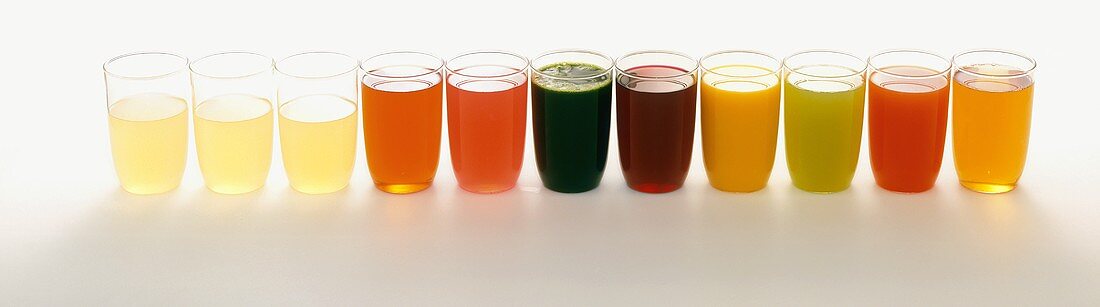 Assorted Glasses of Juice in a Line