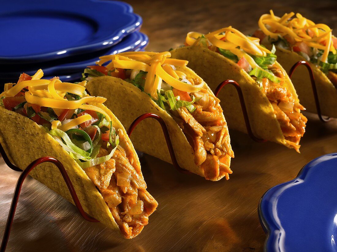 Four Chicken Tacos in a Taco Rack