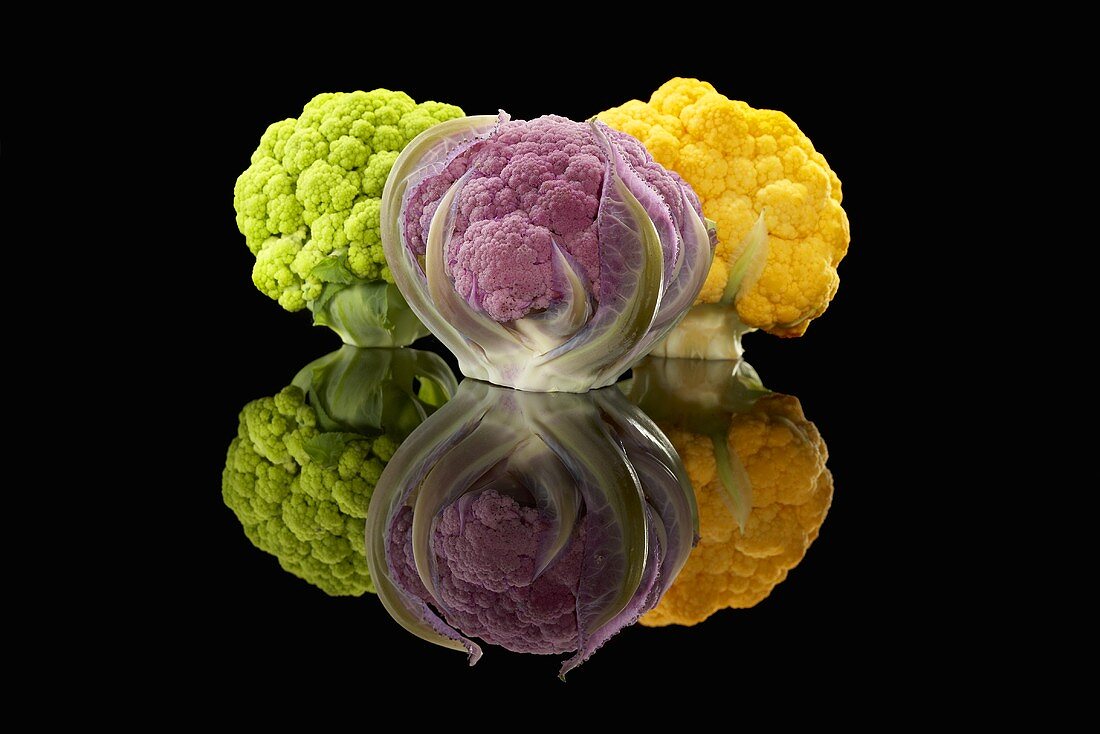 A Green, a Purple and a Yellow Head of Cauliflower