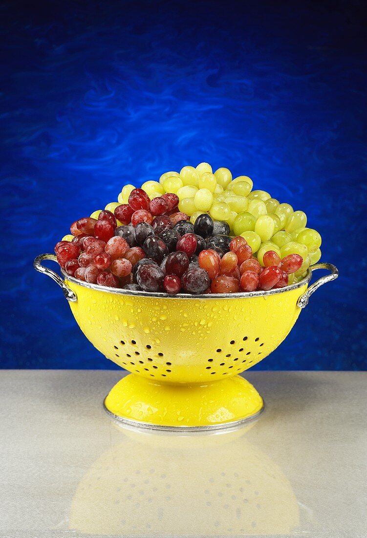 Mixed Grapes in a Yellow Colander
