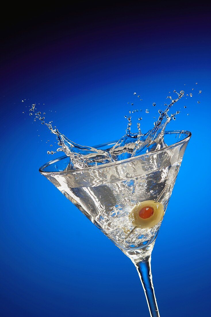 An Olive Splashing into a Martini