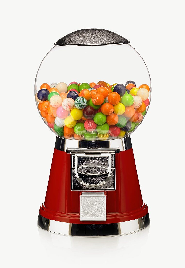 A Candy Machine Half Filled with Gumballs